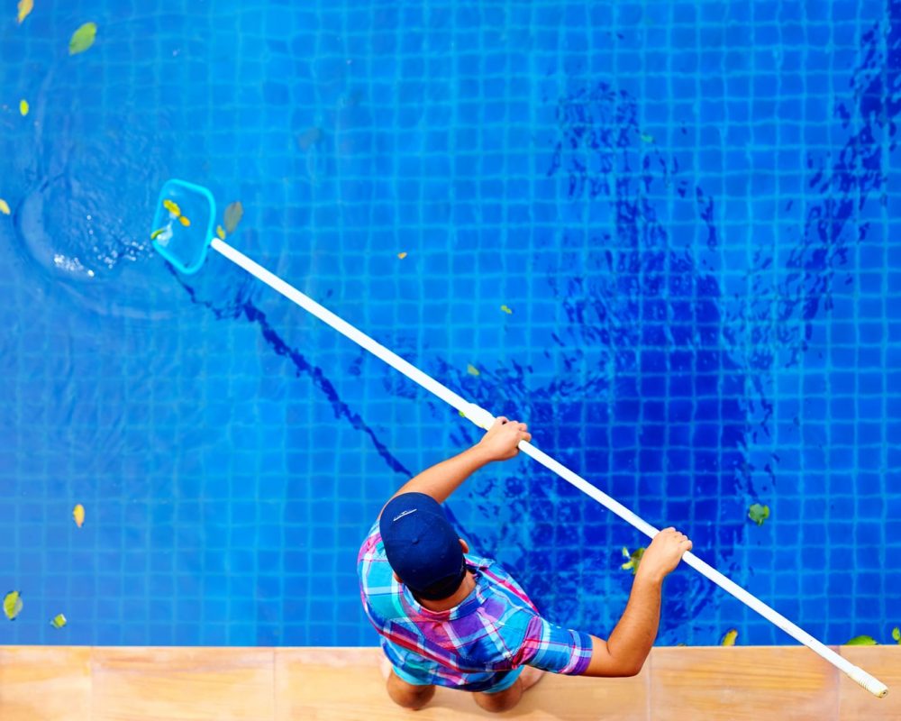 guy cleaning the pool