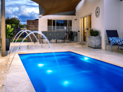 elegant indoor pool elegant swimming pool with chairs & plants and 2 fountains
