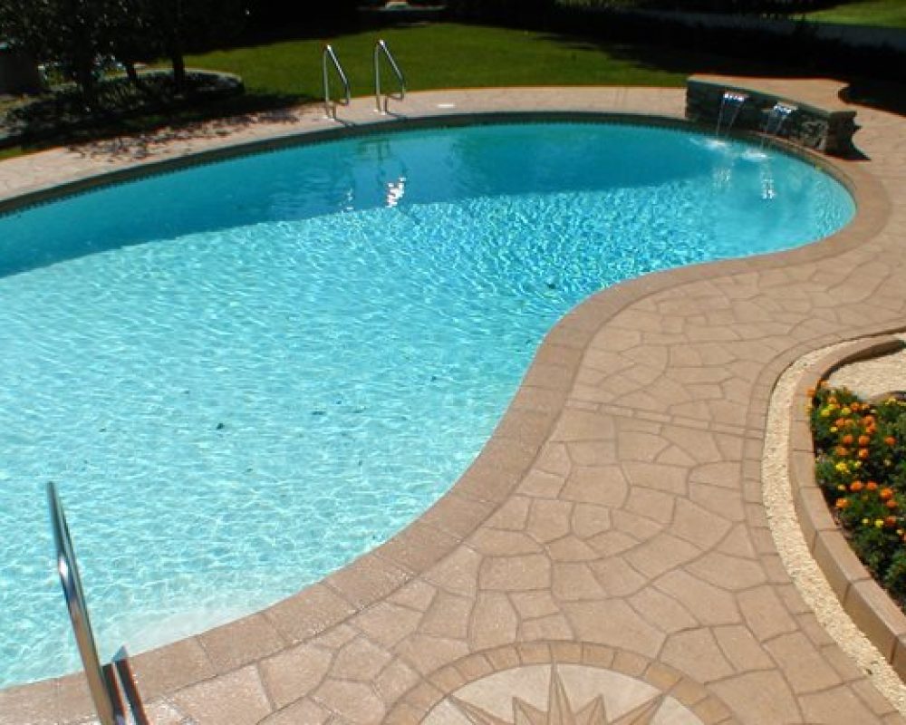 turquoise colored water in a pool with concrete resurfacing