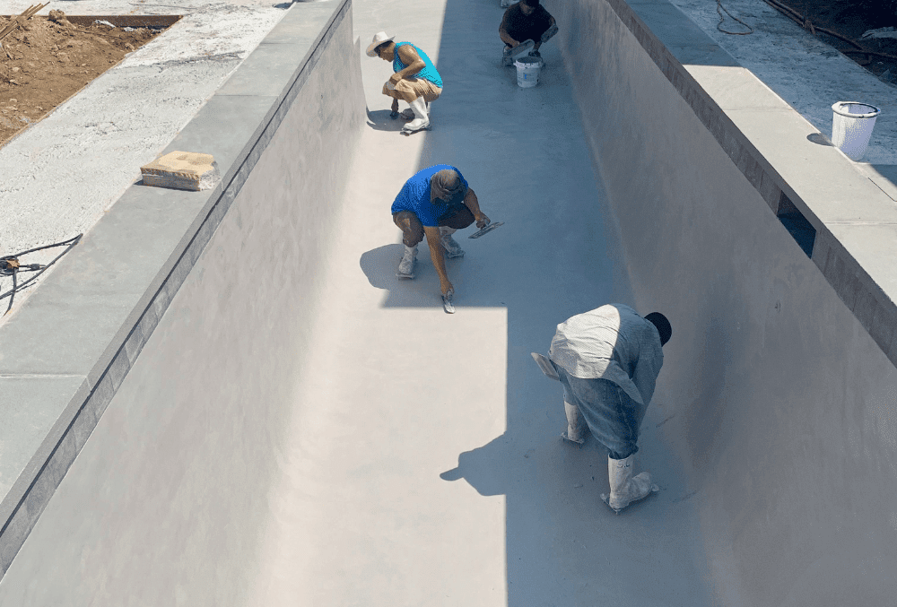 men working on the pool with safety tools